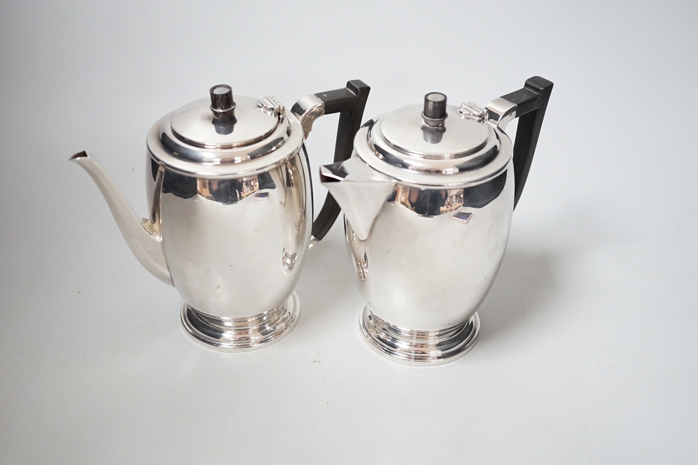 A George V silver cafe au lait pair by Hukin & Heath, Birmingham, 1934, height 15.8cm, gross weight 27.6oz.